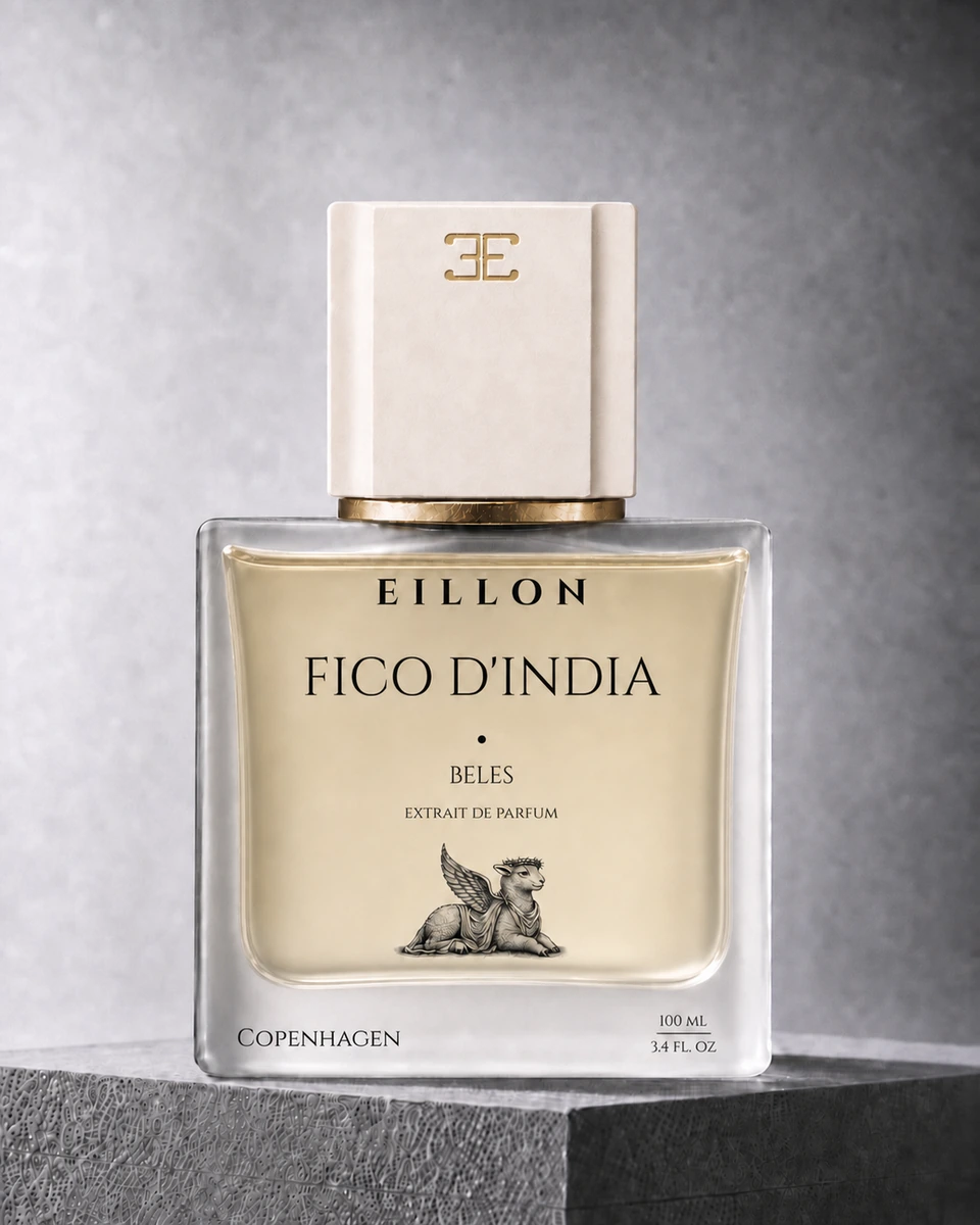 Full Beles Extrait de Parfum concept in a measured frosted-glass cube with an ivory cap, gold-inlaid EILLON emblem, gold collar, and black bottle typography.