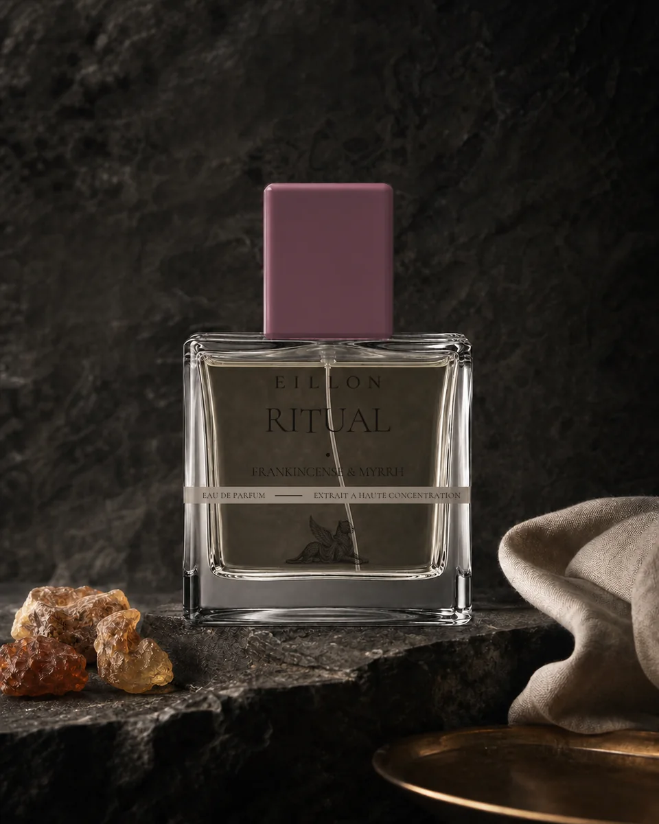 Ritual packaging concept in liquid-filled clear square glass with a muted resin-oxblood cap and complete grey-band typography.